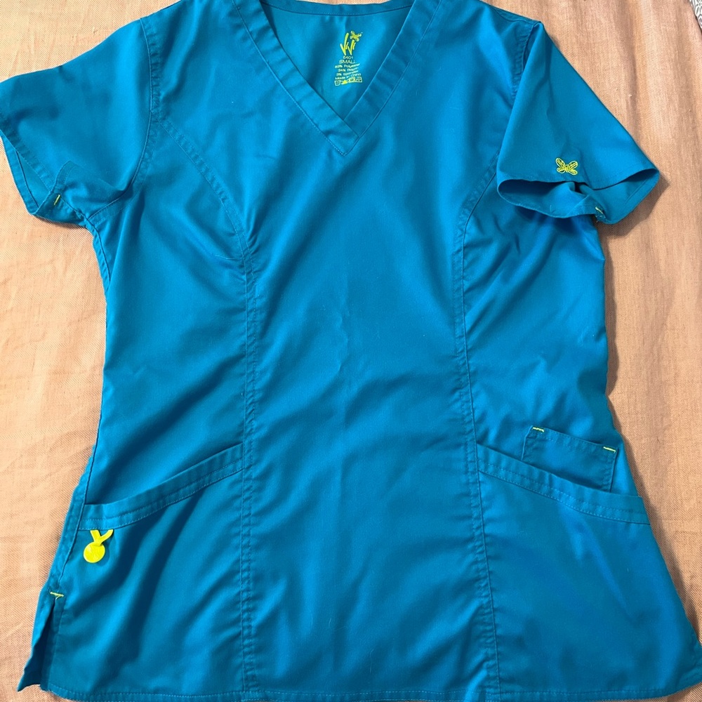 Bright blue scrub top, bright green scrub bottoms.